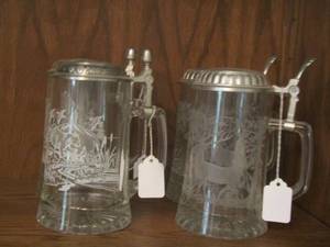 lot 4 image: STEINS    Qty 4  Clear etched glass steins in mint condition, deer- eagle- bear designs