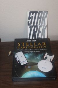 lot 53 image: Star Trek Books and light up Christmas Ornaments