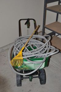 lot 278 image: Lawn Seed Spreader and Water Hose, also Small Rake