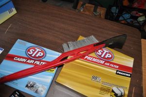 lot 287 image: STP Cabin Air Filter and Intake Air Filter, also Long Ice ScraperBrush, Fit List In Photos