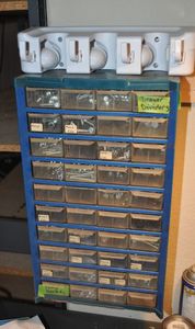 lot 300 image: Hardware Cubbie With Contents Included, 9.5x6x17, also utility Hanger