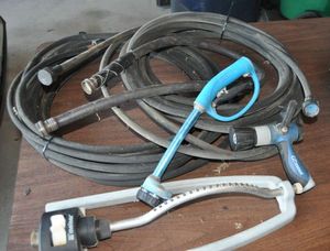 lot 320 image: Two Soaker Hoses, a Sprinkler and Water Nozzles