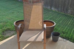 lot 327 image: One Outdoors Chair and Two Large Flower Pots, also a smaller Plastic Flower Pot