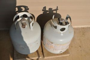 lot 329 image: Two propane Tanks, One Is Possibly Full and The Other Could Be about Half Full, But is a Guess Only.
