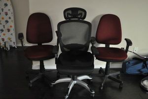lot 338 image: Three Well Taken Care of Office Chairs. One is Designed With The Back In Mind