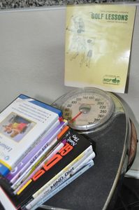 lot 354 image: Exercise DVDs, Healthy Eating Books and Health meter Scales