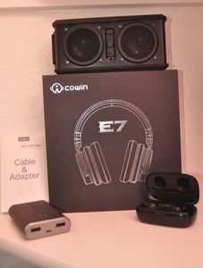 lot 121 image: Cowin Headphones, Speaker, Earbuds and Pocket Juice for cellphones, and phone charger cable with Adapter