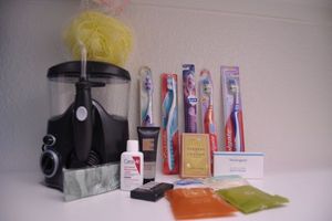 lot 125 image: Several new Toothbrushes, Water Pik, and other Hygiene Products