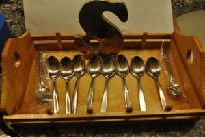 lot 139 image: Wooden Tray with Letter S for  Spoons  including Two Rolex Spoons
