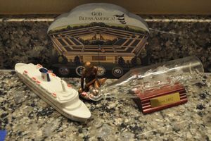 lot 142 image: Glass Ship in a Bottle Nina 1492, Pentagon, Brass Mermaid on Rock and a ceramic Cruise Ship