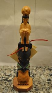 lot 143 image: Hand Carved Alaskan Cedar,  Black Diamond Small totem Seawomen by Ray Moore