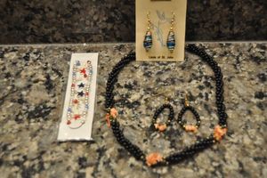 lot 144 image: Jewelry 14Kt Gold Filled Linda of St. John Earrings, Freedom Bracelet, and Vintage Black Beaded and Coral Necklace and Earrings