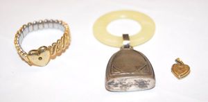 lot 151 image: Antique Sterling Silver Baby Rattle with Mother of Pearl Teether Ring, 12Kt Gold Filled Sweetheart Bracelet, Missing Stone, and Small Heart Locket