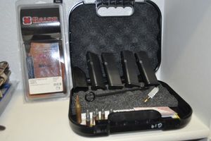 lot 172 image: Glock Gun Case, Extra Clips, Gun Holster, and some ammo rounds