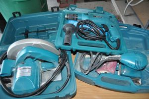 lot 12 image: Three Piece Set of Makita Corded Power Tools with Cases, Drill, Skill Saw 7 14 Blade Size and Sander
