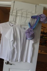 lot 351 image: Childrens T-Shirts and swim Floaties