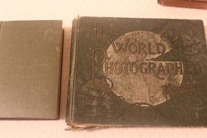 lot 69 image: Vintage Books The World Photographed Arranged and Published by Henry Neil 1893, Mark Twain Authurs National Edition Volume XX Samuel L Clemens Copyright 1917