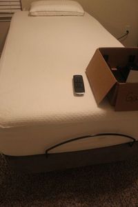 lot 75 image: Twin XL Adjustable Bed, Comes with Hardware to Connect a Headboard. also Can be a King Size with the Second one listed (lot 77). Mattress is Avail, Clean and Has always been covered.