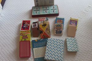 lot 101 image: Vintage Skip-Bo, and Several Decks of Cards, including Old Maid, Mickey Mouse Playing Cards, Busy Bee Card Game and More