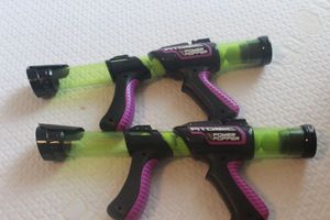 lot 104 image: Two Atomic Power Popper Guns Each with 7 Balls