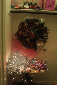 lot 114 image: Christmas Dcor Clear Net Style Lights, and several Mini Mult-colored Lights, Christmas Wreath with Storage Container (Table not Included)