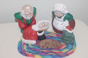 lot 116 image: Christmas Dcor Vintage Ceramic Santa and Mrs. Claus, over looking the Sleeping Dog, and Kitten Sleeping in Santas Clothes. Smiling Ceramic Christmas Tree