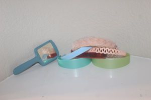 lot 120 image: Several Vintage Plastic Headbands and Hand Mirror