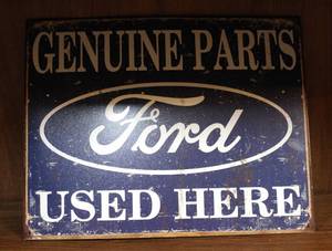 lot 13 image: Genuine parts Ford used here metal sign