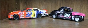 lot 24 image: 1997 Racing Champions issue  99 exide batteries and 1999 Mattel #32 Tide MATTEL NASCAR  Ford Taurus Race Car