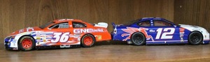 lot 28 image: NASCAR #36 Hank Parker Jr (124 - Diecast Stock Car - GNC)  and Hasbro#12Jeremy MayfieldMobil 1NASCAR1998 Ford Taurus132