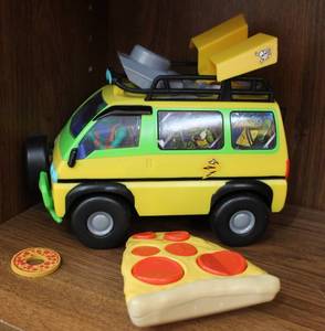 lot 59 image: Teenage mutant Ninja turtle remote control car that shoots Pizza disc worked when posted