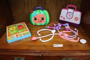 lot 62 image: Previously loved Blue clues block puzzle and cocomelon bag and doc Mc Stuffin bag with others