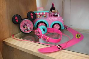 lot 65 image: Minnie mouse remote control car and Minnie mouse headphones and a boomerang needs batteries could not test