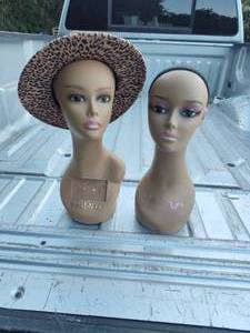 lot 74 image: Two mannequin heads and a hat as seen in picture