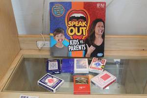 lot 93 image: Game lot  speak out and playing cards