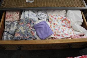 lot 105 image: pillowcases and more get all in drawer (dresser not included)