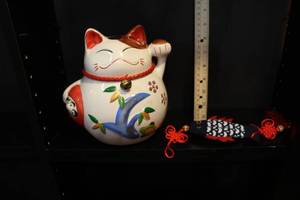 lot 116 image: lucky fat cat bank and fish