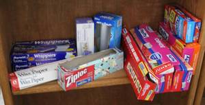 lot 158 image: Ziplocs wax paper and aluminum foil sheets all open but all have things in it
