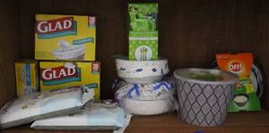lot 159 image: Trash bags some unopened paper plates paper bowls plastic silverware and two citronella candles unopened