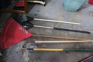 lot 179 image: Mixed outdoor lot plastic racks metal rake hoe as seen in pictures