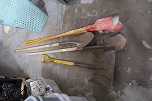 lot 212 image: post hole digger and shovels