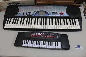 lot 270 image: Keyboards missing the plugs small one is missing the battery back