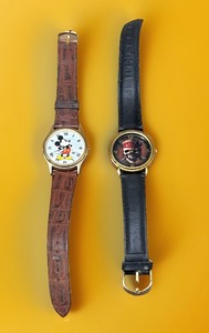 lot 32 image: Vintage MICKEY MOUSE WATCH LORUS Quartz V500-7A30 &amp Disney Special Edition Collectors Series Pirates of the Caribbean Skull Watch - Only Sold at Park