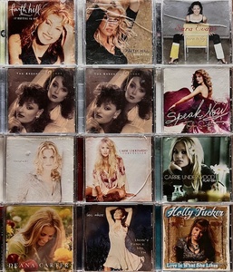 lot 197 image: Twelve CDs - From Some of Countrys Greatest Female Artists - Including Faith Hill,The Judds.,Taylor Swift, &amp Carrie Underwood WHolly Tucker Autographed CD