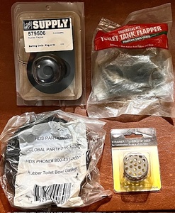 lot 238 image: Two Toilet Tank Flappers, Rubber Toilet Bowl Gasket, &amp 1-12 x 78 Deep Sink Strainer
