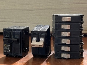 lot 256 image: Eight (8) Single &amp Double Throw 20 and 30 amp Breakers - Including Square D
