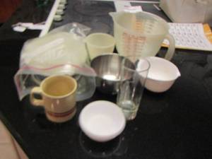 lot 219 image: measuring cups, coffee cup, and more