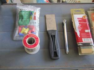 lot 232 image: batteries, roll of small metal, wire nuts, tire pressure gauge