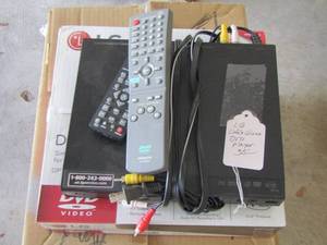 lot 237 image: LG  dvd player with 2 remotes