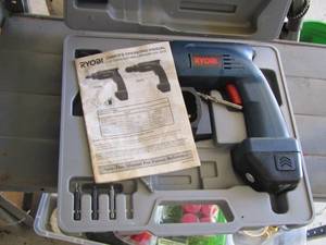 lot 266 image: ryobi battery operated drill with battery and charger